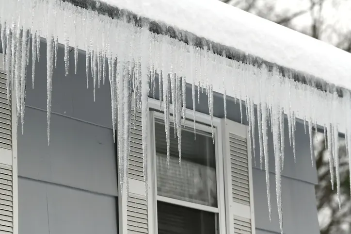 icicle on the house roof in winter season